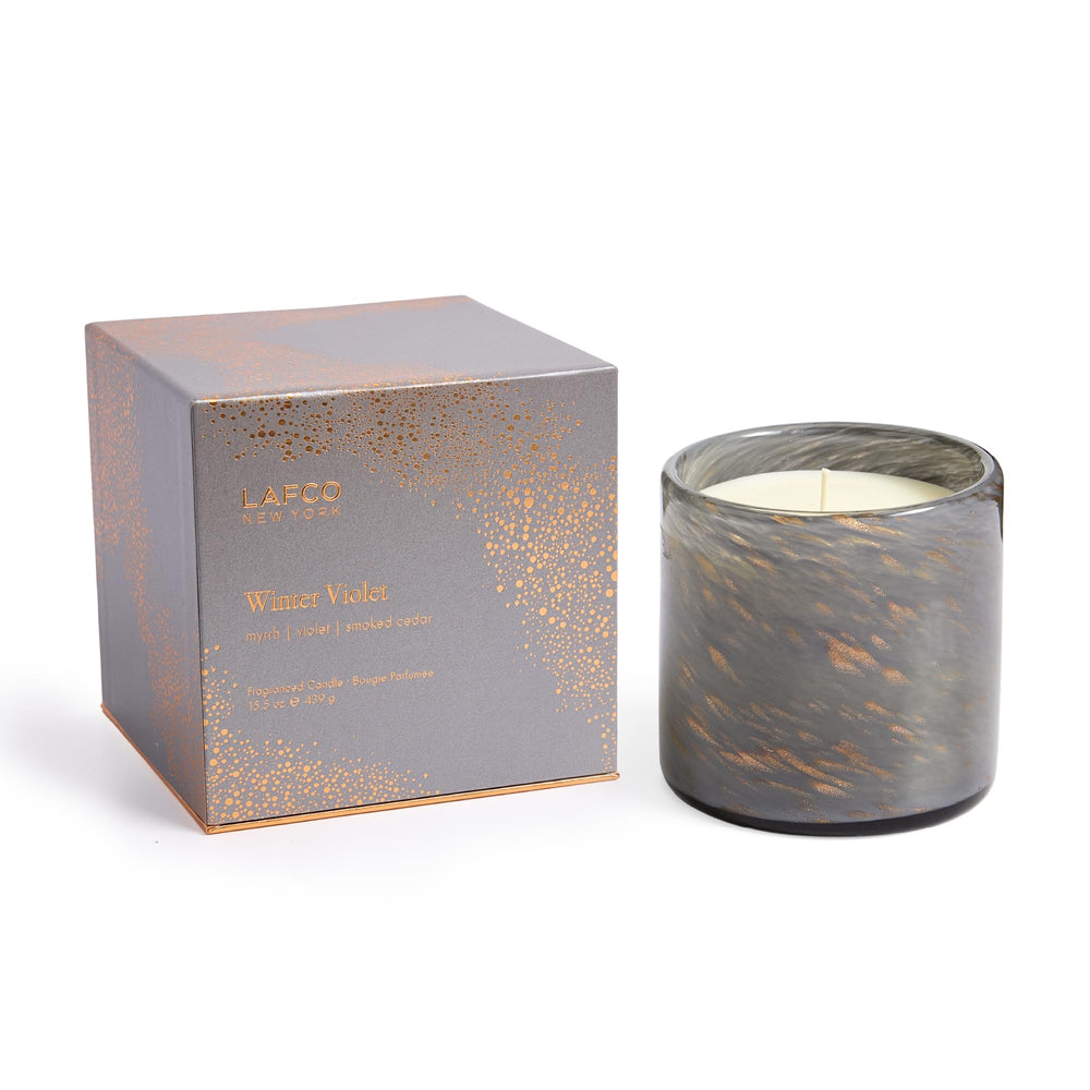 LAFCO New York Winter Violet candle in a hand-blown glass vessel for festive ambiance.