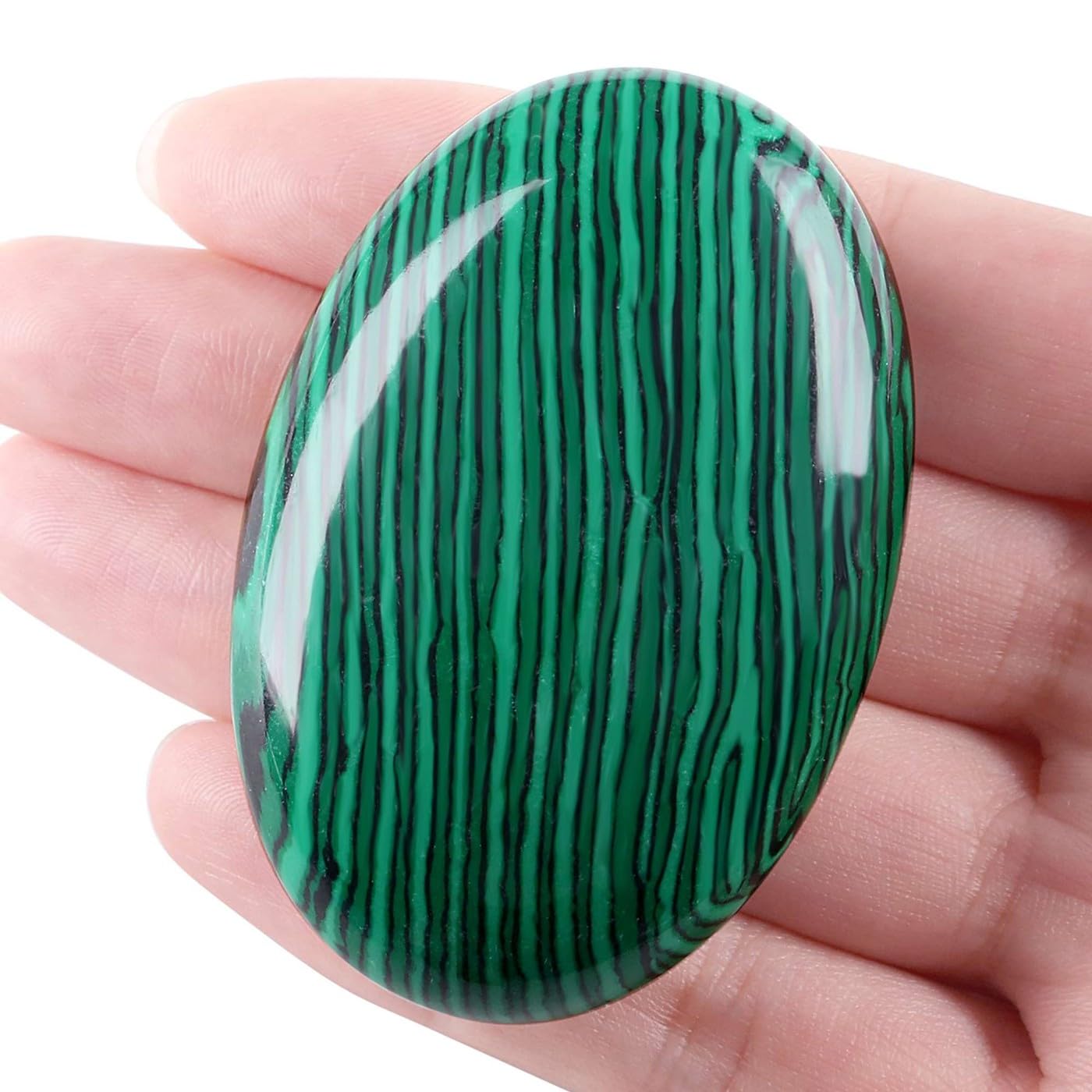 LAIDANLA Malachite palm stone oval held in hand for calm focus and balance.
