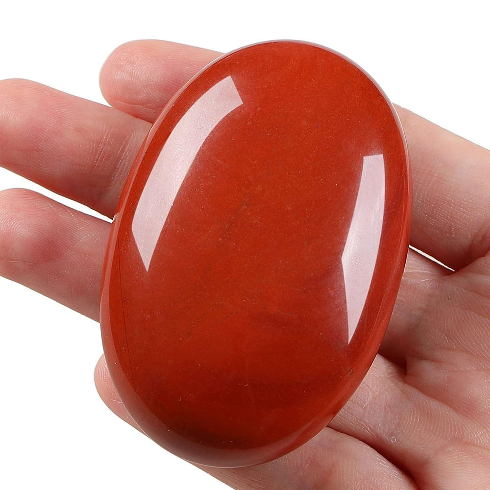 LAIDANLA Red Jasper palm stone in hand ready for portable stress relief and focus