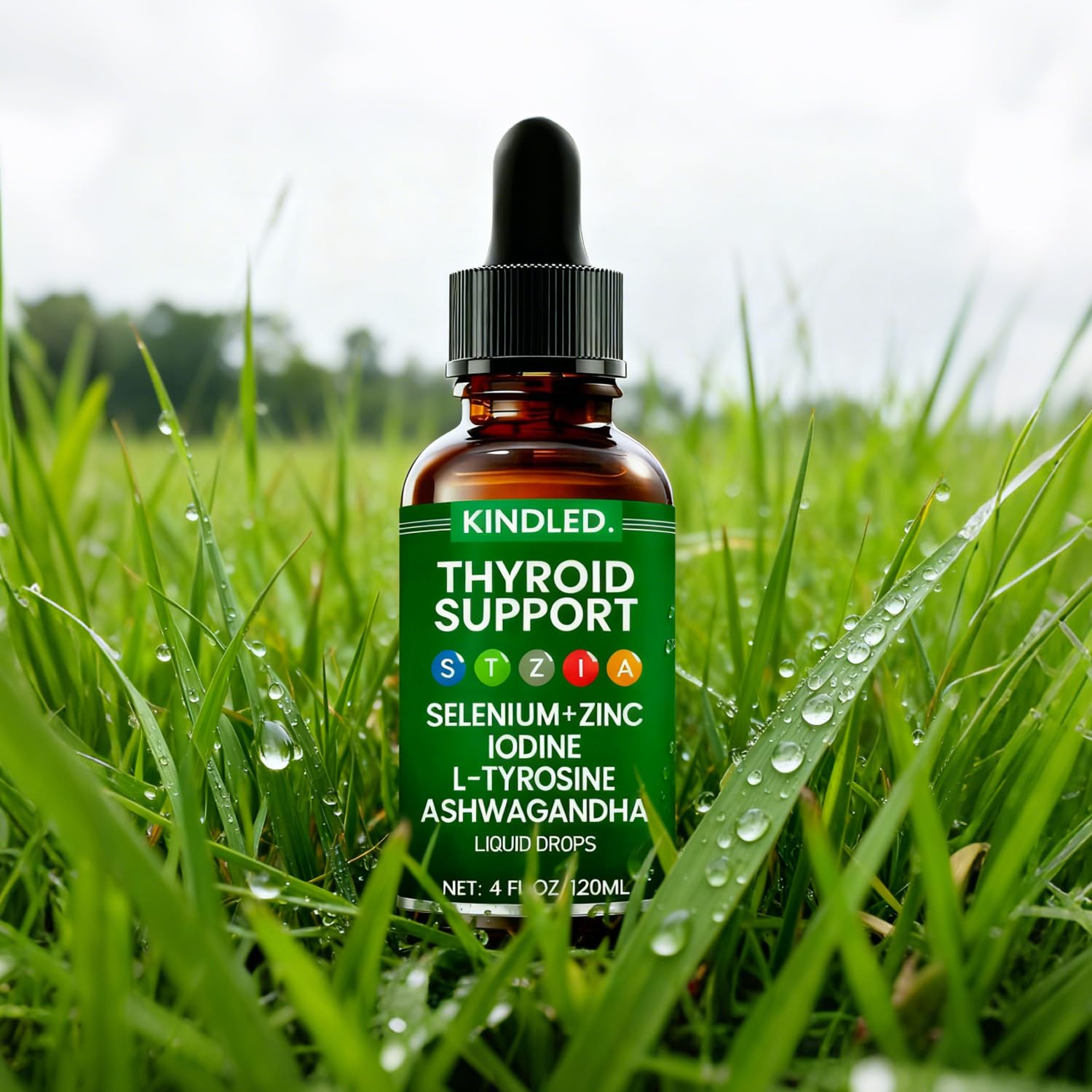 LANZF Kindled Thyroid Support Drops bottle beside water for easy mix-in.
