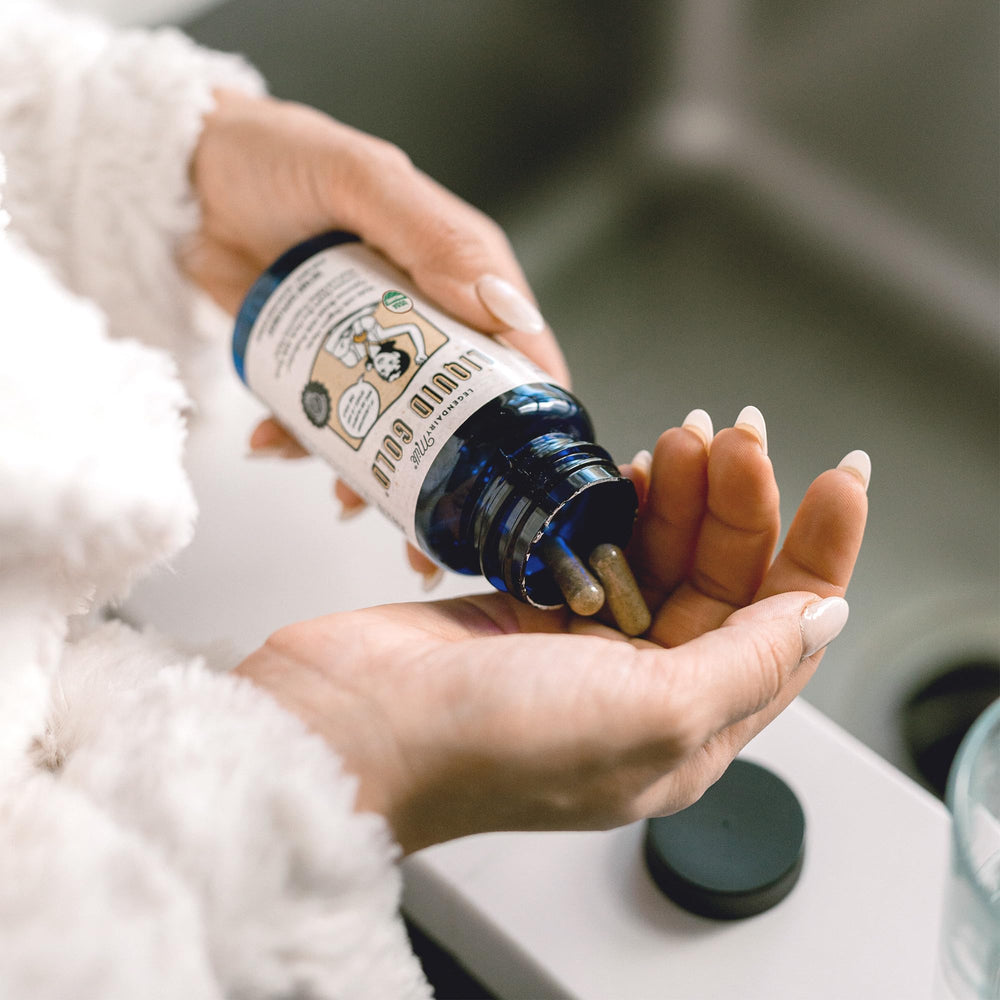 Legendairy Milk Liquid Gold capsules shown, highlighting vegan and quality certifications.