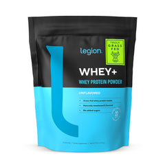 LEGION Whey+ scoop beside bottle for convenient daily serving