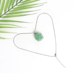 LERSUSI fluorite pendant in a slender cage for versatile styling.