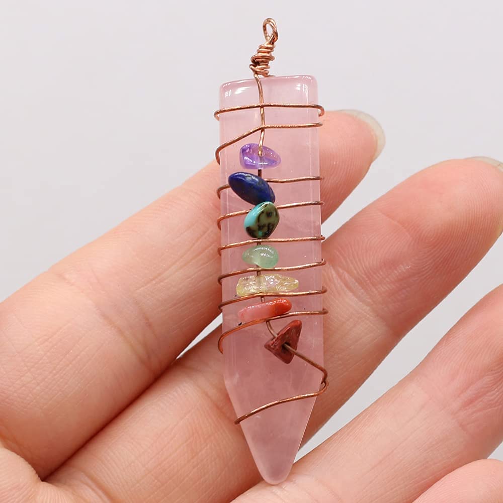 LHJ necklace making stone pendant in hand for project planning.