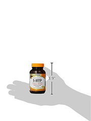 Pouring Lidtke 5-HTP capsules from the bottle for daily use