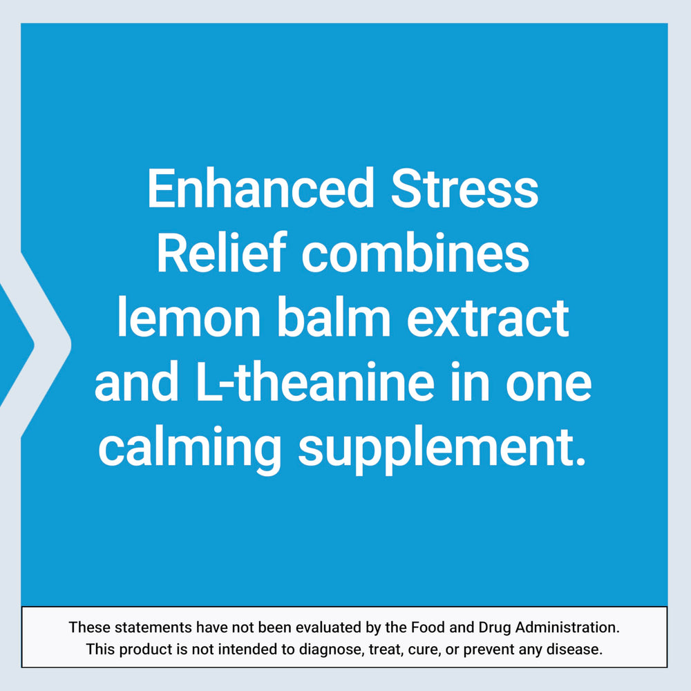 Life Extension Enhanced Stress Relief capsules on wood surface for daily calm moments.