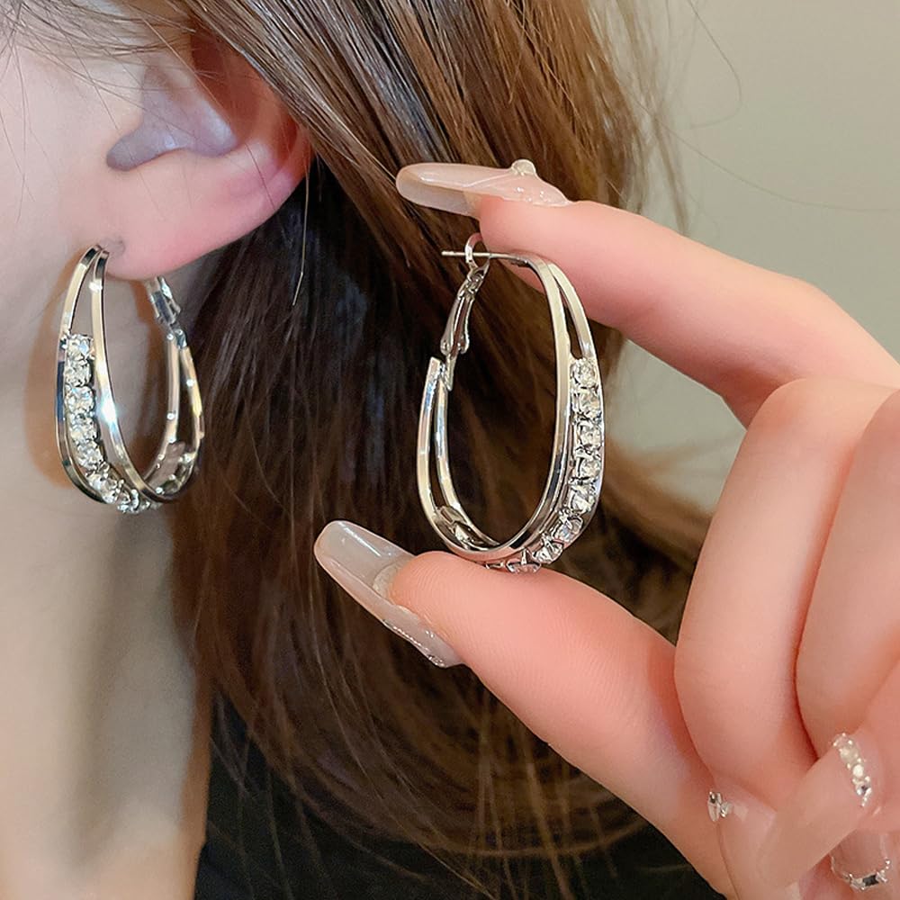 LIU JUN Lymphvity hoop earrings close-up texture showing detail