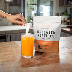 Pouring Live Conscious Collagen Peptides Peach Mango into a drink for easy mixing.