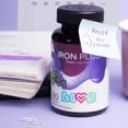LIVS iron gummies with workout gear for stamina.