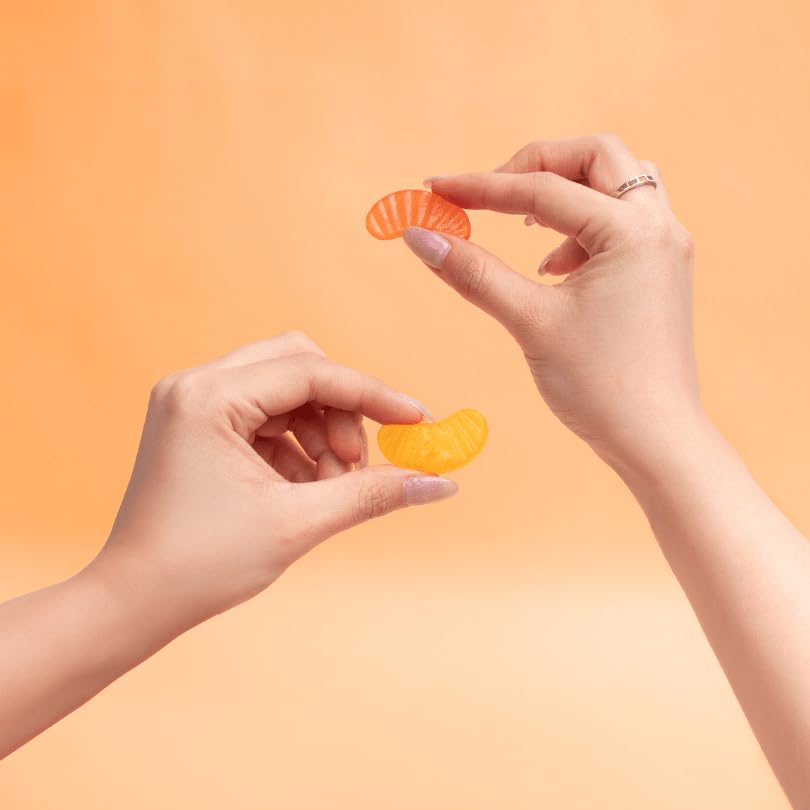 LIVS gummy on spoon illustrating easy daily dose.