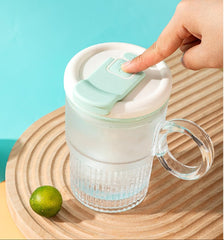 LMFUEN automatic stirring mug cyan lid close-up highlights leak-proof travel seal.