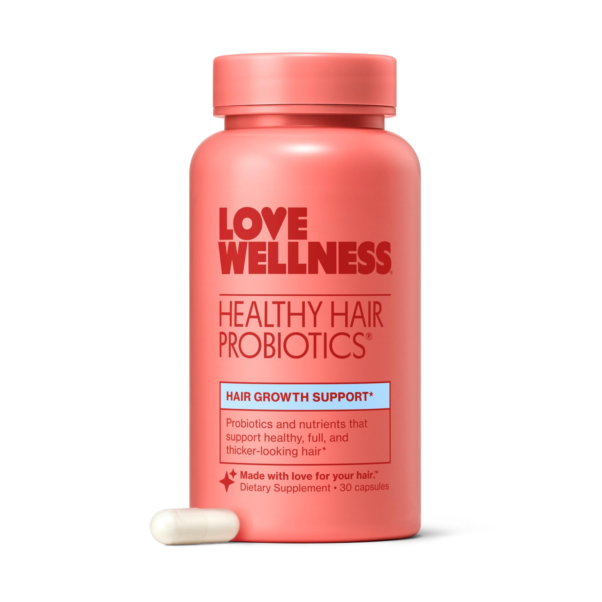 Love Wellness Healthy Hair Probiotics bottle on a clean surface, suggesting fuller-looking hair.