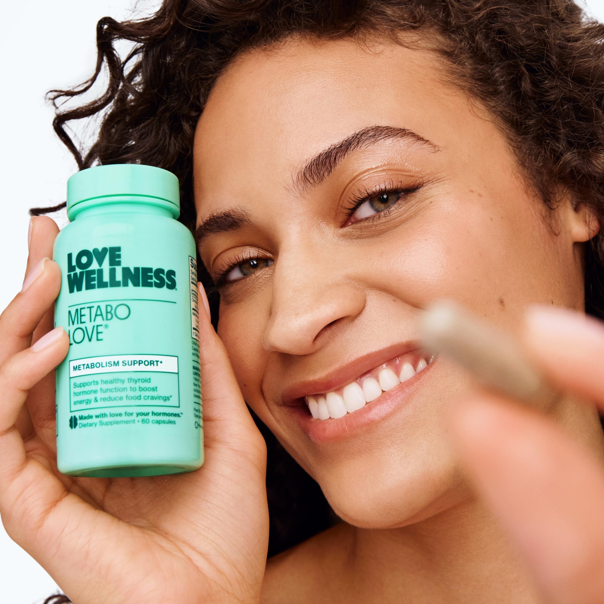 Lifestyle image of someone taking Metabolove during morning routine for energy.