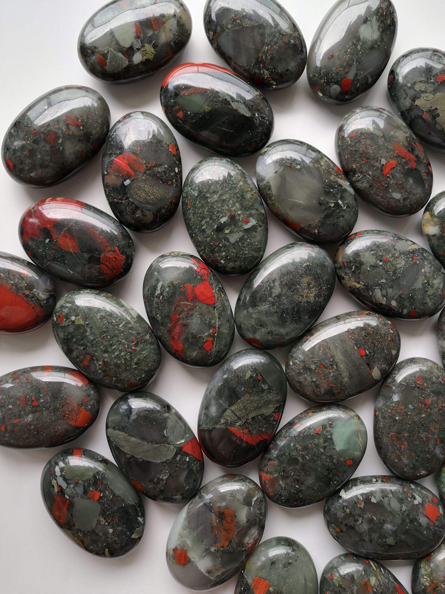 Loveliome bloodstone oval worry stone highlighting natural variations and patterns