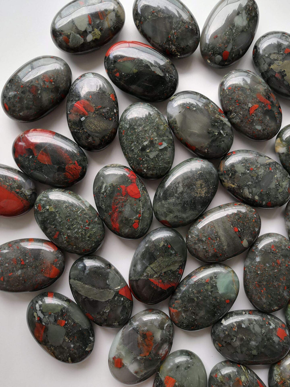 Loveliome bloodstone oval worry stone highlighting natural variations and patterns