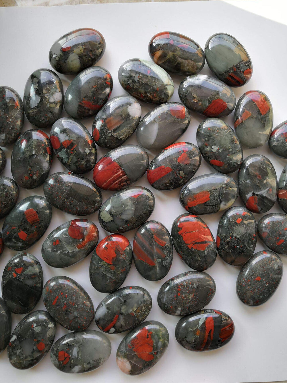 Loveliome bloodstone oval worry stone sized for pocket carry and daily calm