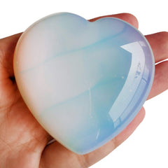 Loveliome Synthesis Opalite heart in hand, smooth touch ideal for grounding rituals.