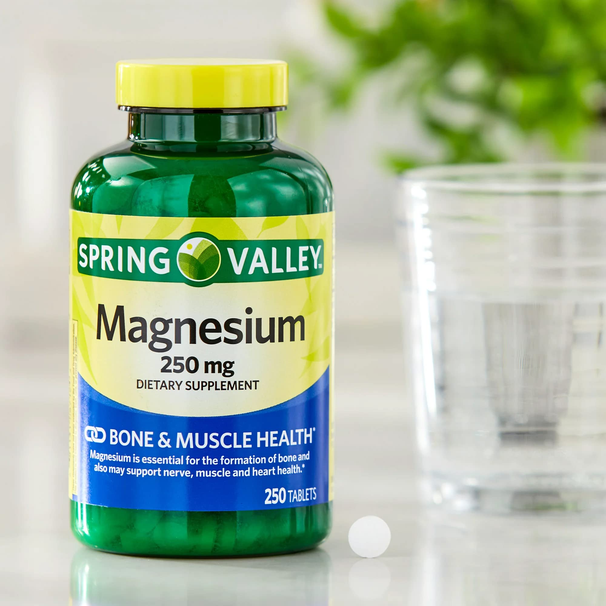 Lual Spring Valley Magnesium bottle shown with pouring action.