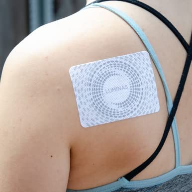 LUMINAS Relief Patch on the shoulder for discreet daily wear and gentle adhesion.