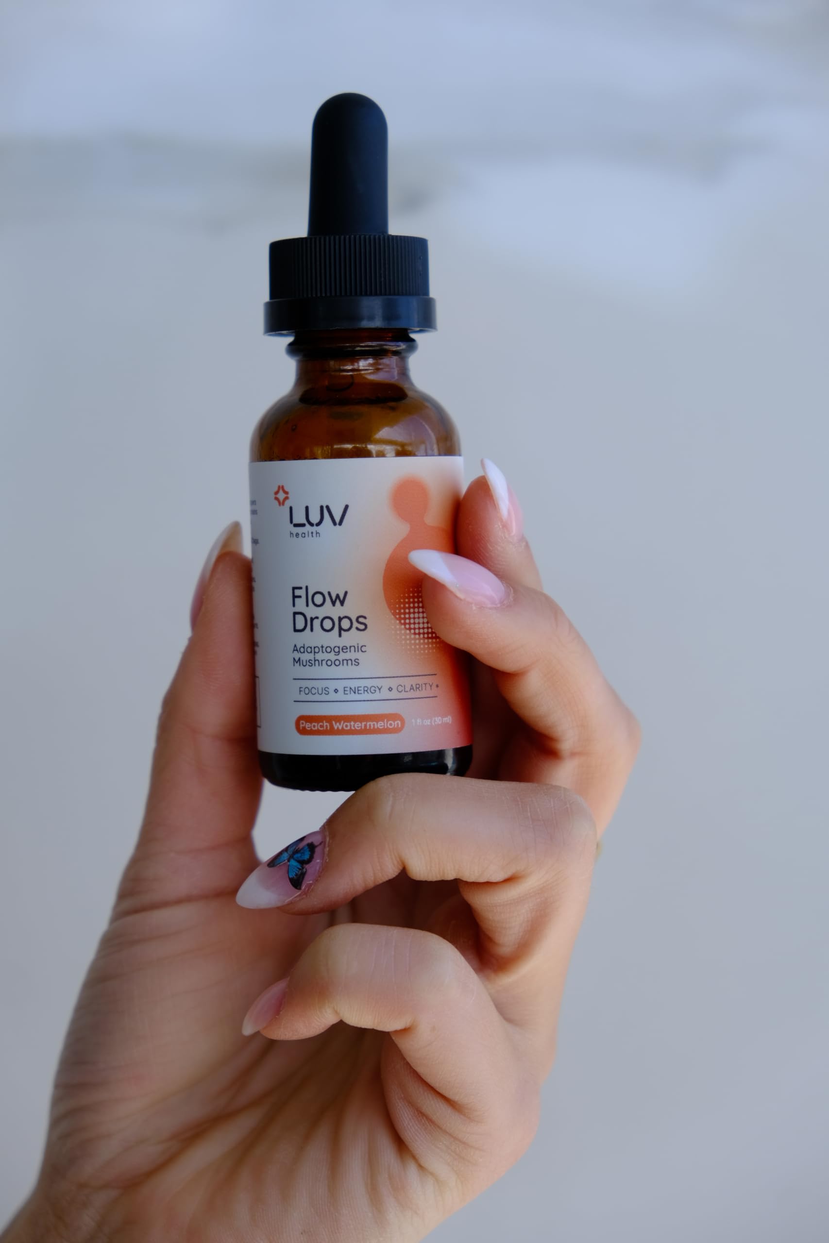 LUV health Flow Drops product shot with serving idea suggests flexible usage.