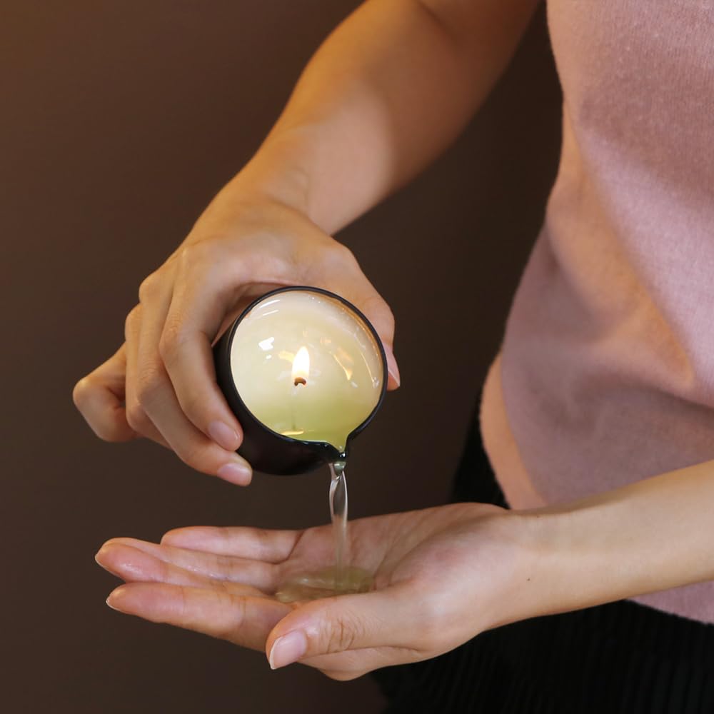 LuxMasa Massage Candle melts into warm oil for a smooth massage.
