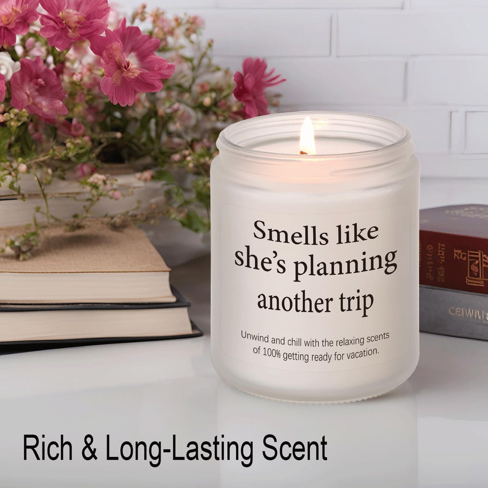 LYYVOHXL travel candle with passport and headphones evokes jet set vibes.