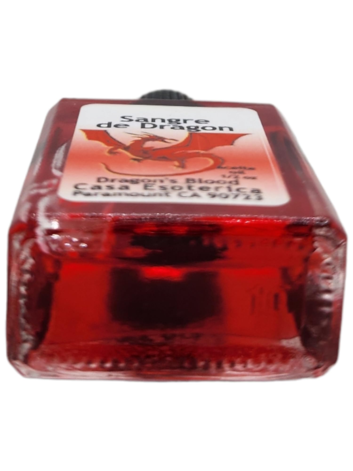 MAGICK SPACE Dragon's Blood Oil candle dressing close-up, steady focus for manifesting goals.