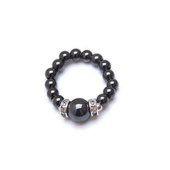 MAGNEHEALTH magnetic hematite ring close-up highlighting beaded style and relaxation.