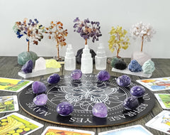 Amethyst crystals set up for meditation to invite focus.