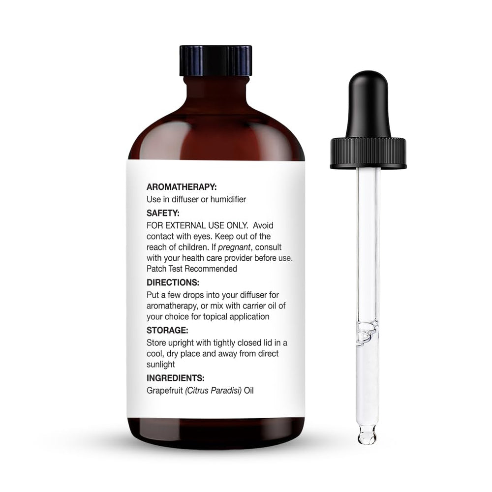 Closeup of Majestic Pure grapefruit oil dropper for accurate measurements.