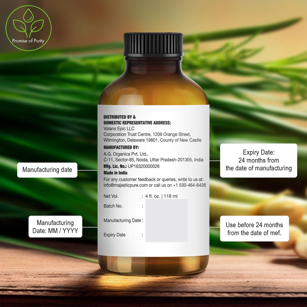 Majestic Pure lemongrass oil bottle on wooden surface conveys natural quality.