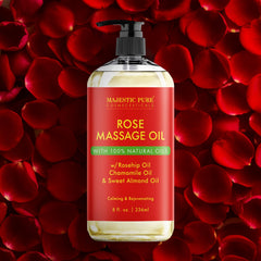 Majestic Pure Rose Massage Oil on a spa table for skin relaxation.