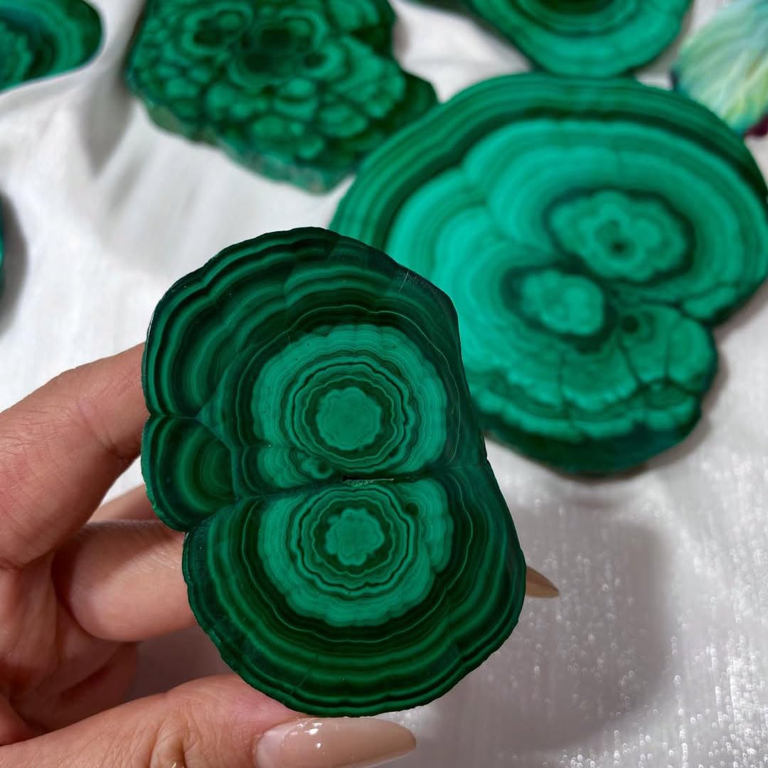 Malachite slab on desk creates a calm workspace ambiance.