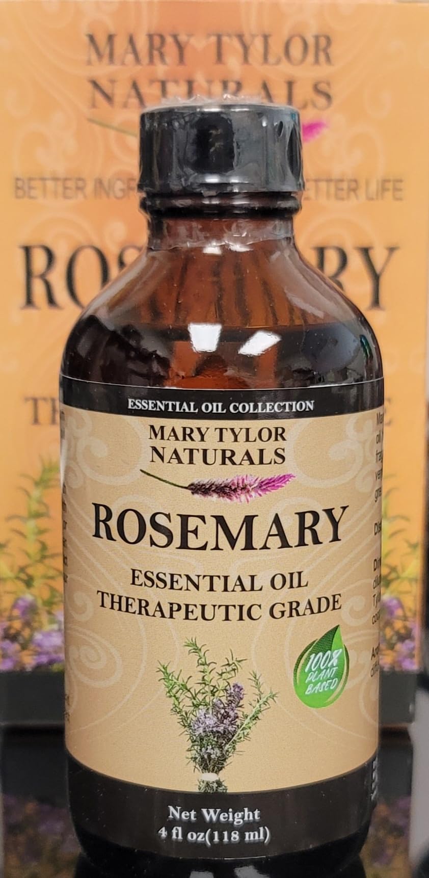 Close-up of rosemary oil label and glass dropper, great for precise dosing in diffusers.
