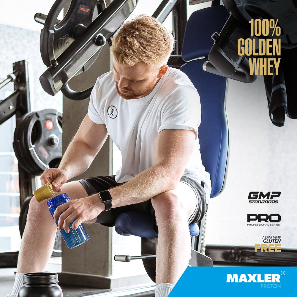 Maxler 100% Golden Whey blueberry muffin powder being poured into a glass