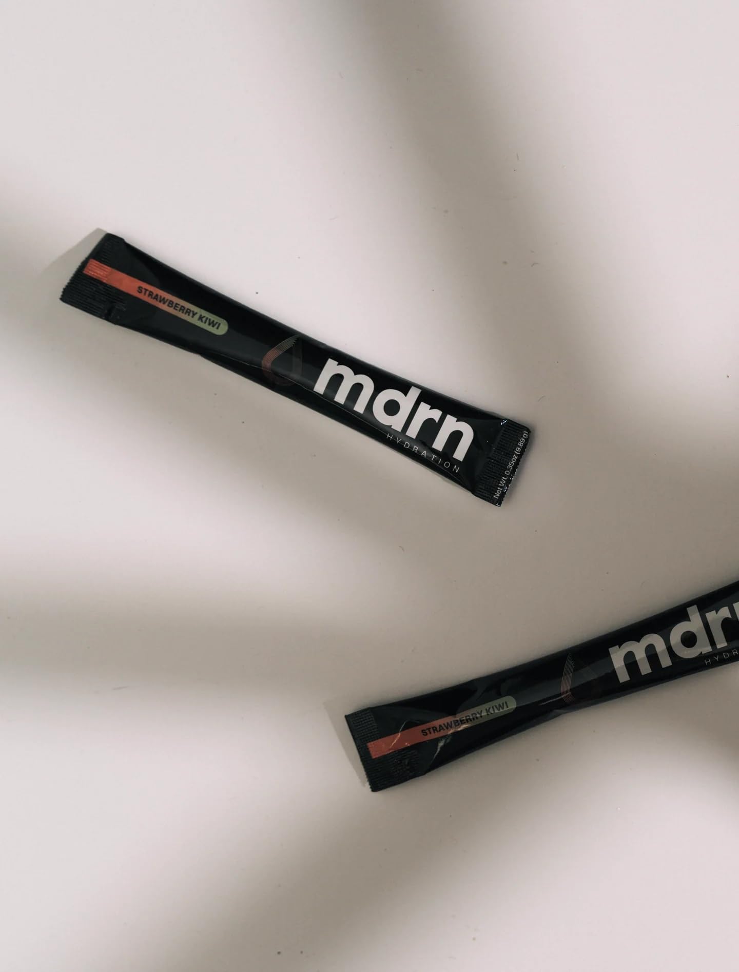 MDRN Hydration strawberry kiwi sticks dissolve easily for a refreshing boost.