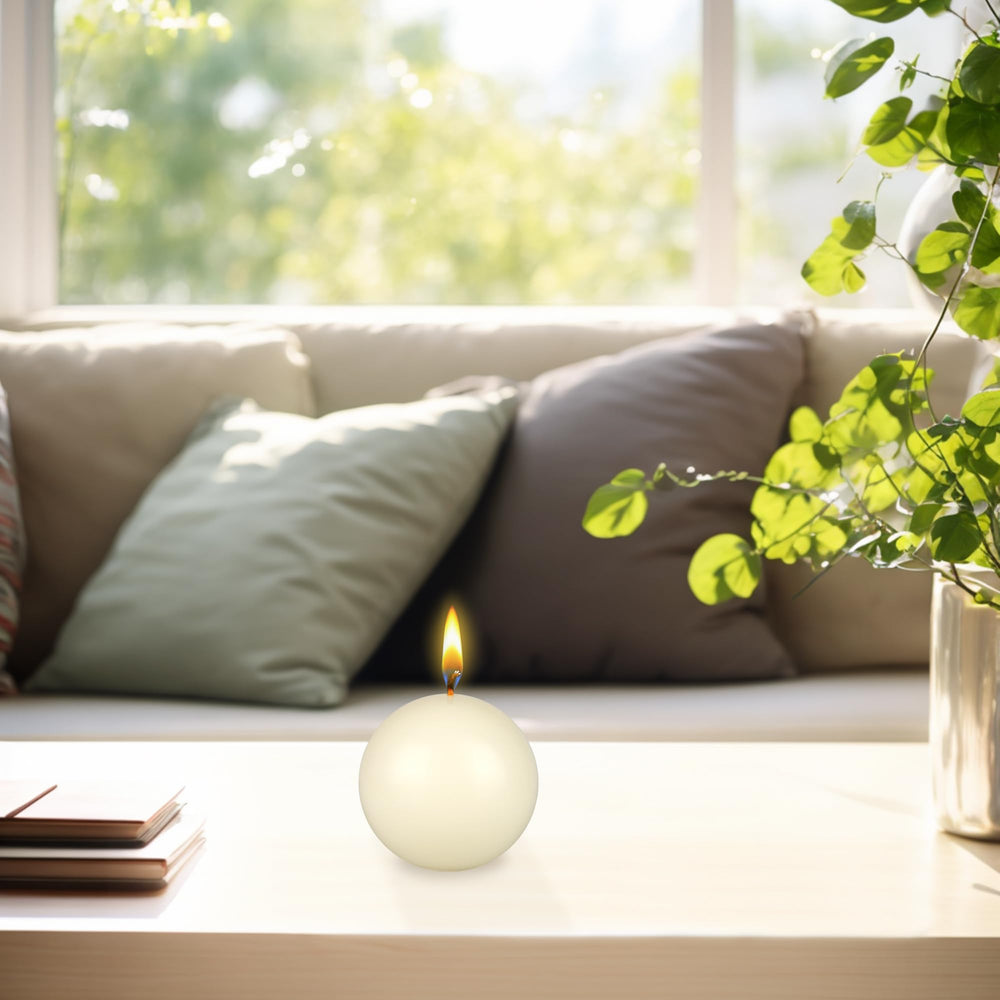 Mega Candles ivory ball candle in glass jar offers elegant decorative glow.