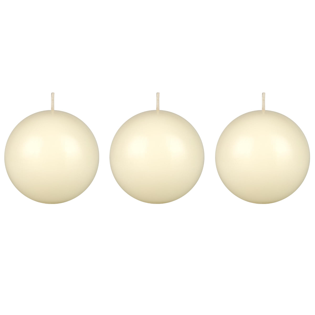 Mega Candles ivory ball candle on table creates warm ambience for dining.