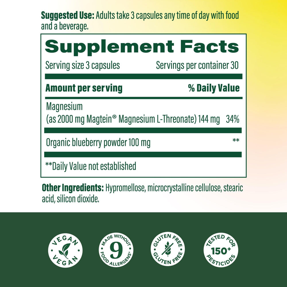 MegaFood Magtein capsules on a spoon for easy daily dosing and alertness.