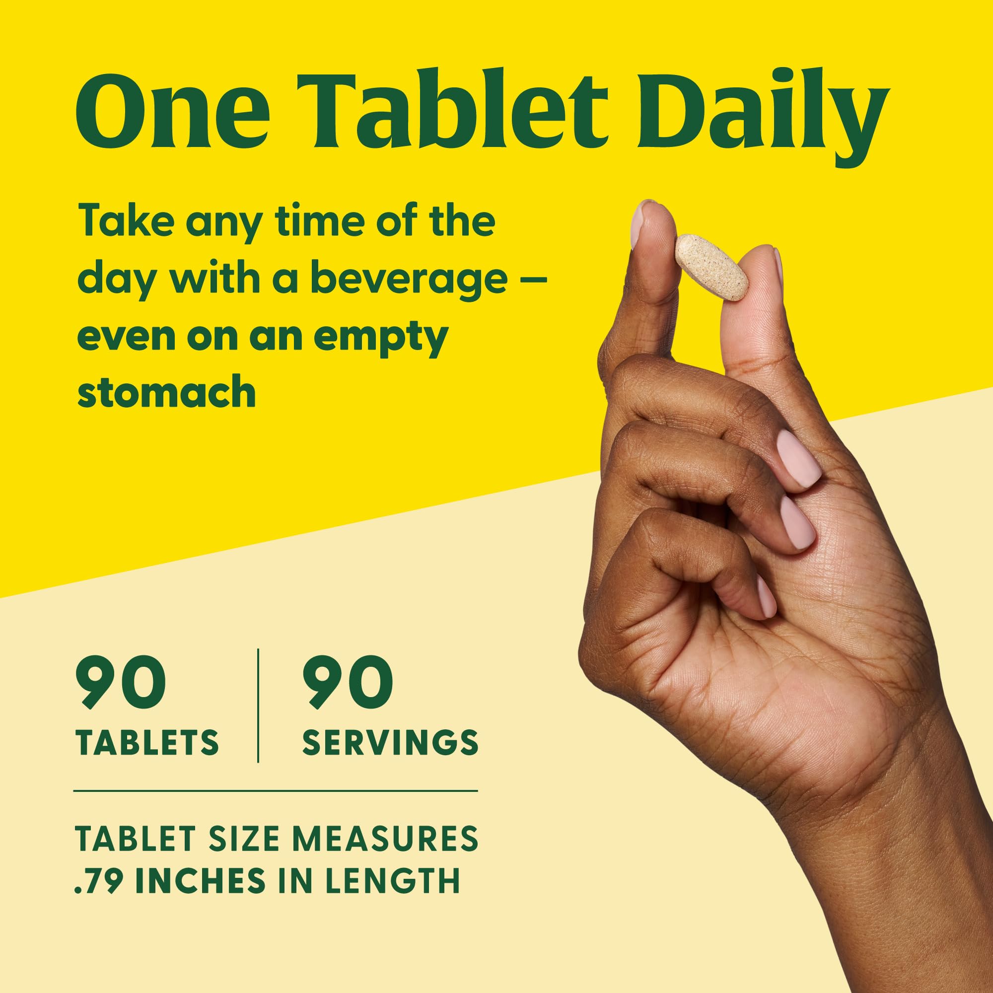 Person taking MegaFood Ultra C tablet with water for daily use