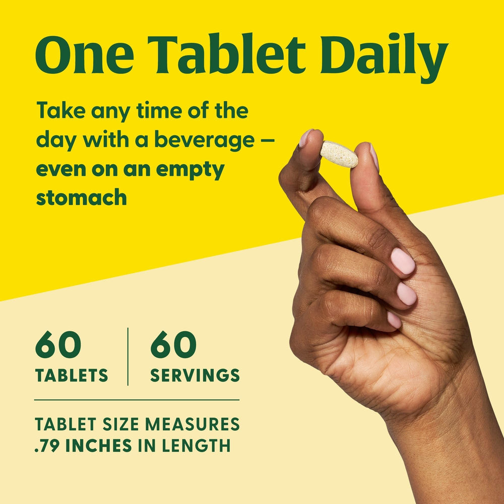 MegaFood Vitamin D3 tablets beside a glass of water for daily use.