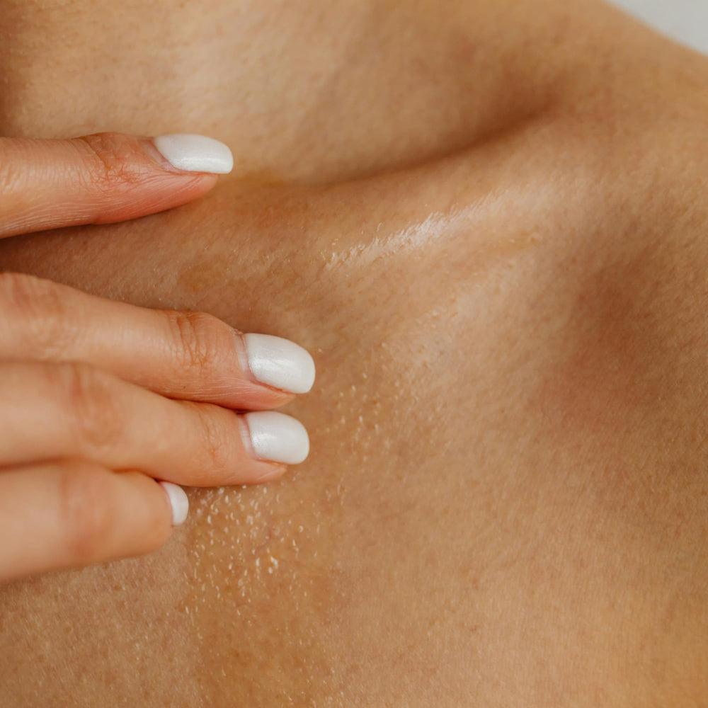MELONY massage candle oil application shows silky, non-greasy absorption.