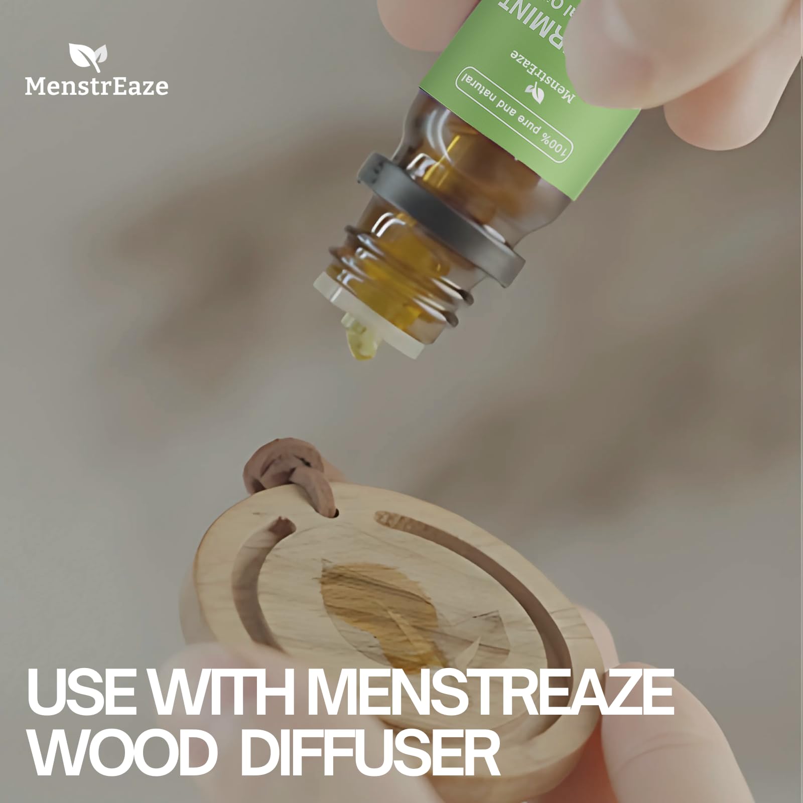 MenstrEaze bottle in hand ready for quick aroma or skin use