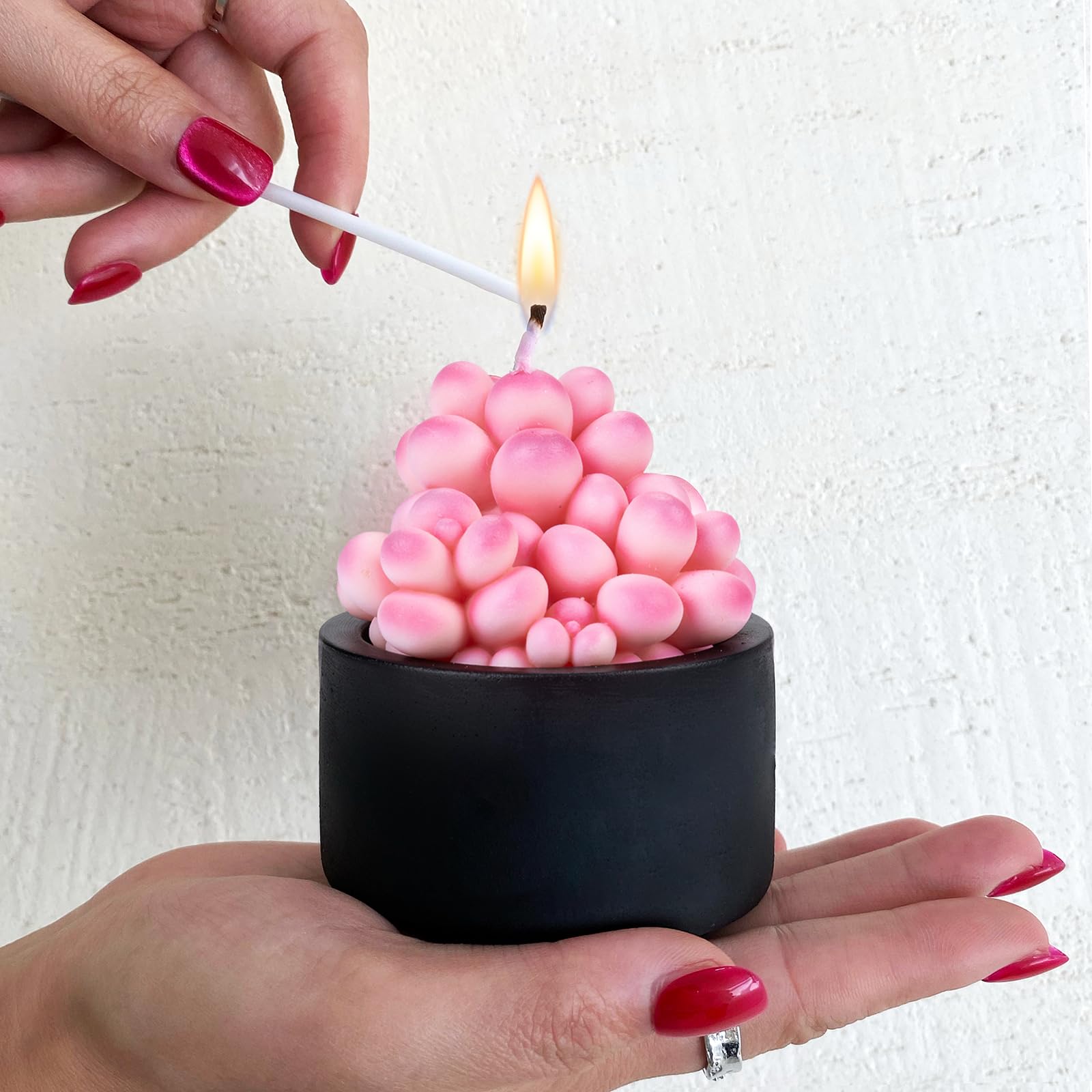 Mesiiloly candle in black vase creates a striking decor focal point
