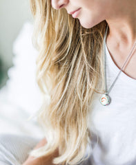 mEssentials stainless steel locket on a 24-inch chain for secure, stylish wear