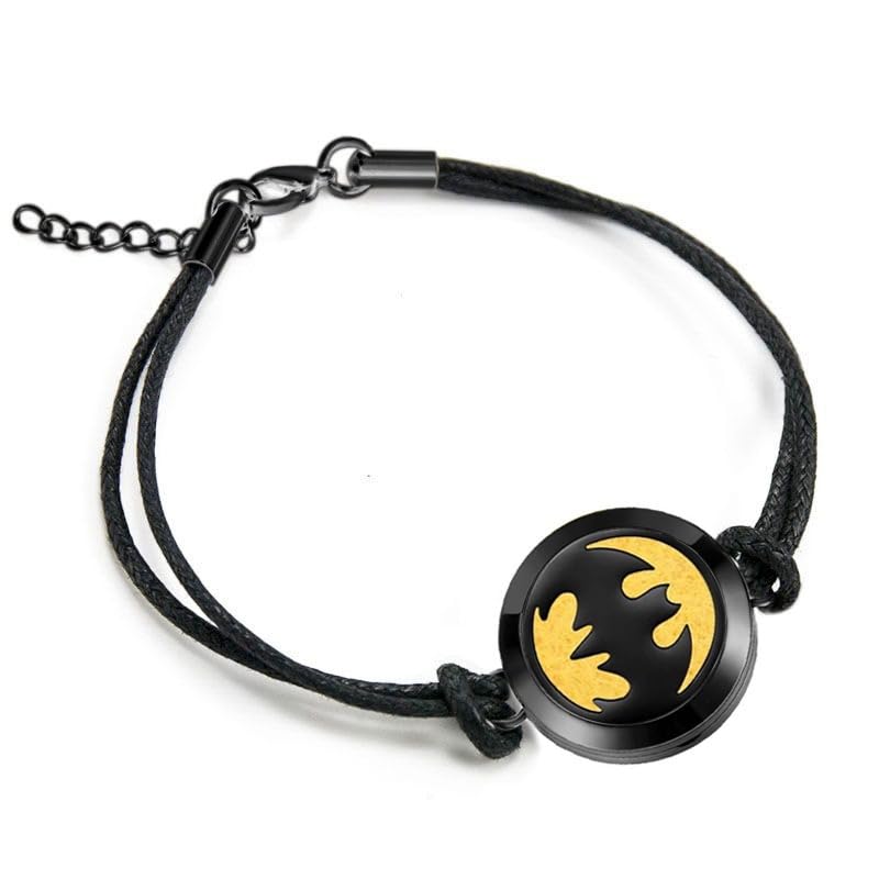 The mEssentials Wild Essentials black chrome diffuser bracelet on the wrist enables portable aromatherapy.