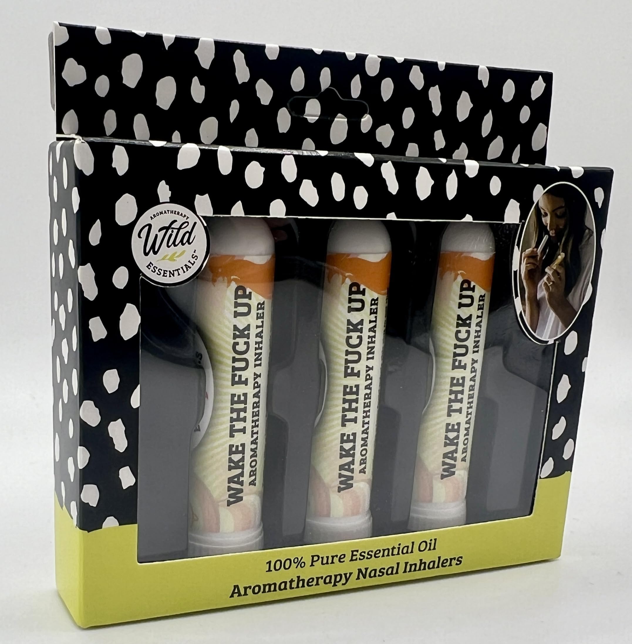 Closeup of Wilder Wake The F Up inhaler highlights peppermint and rosemary notes for quick focus.