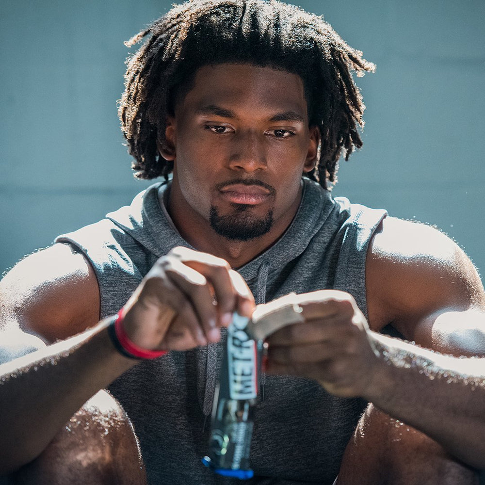 MET-Rx Big 100 Colossal pre-workout scene ready for fueling before training.