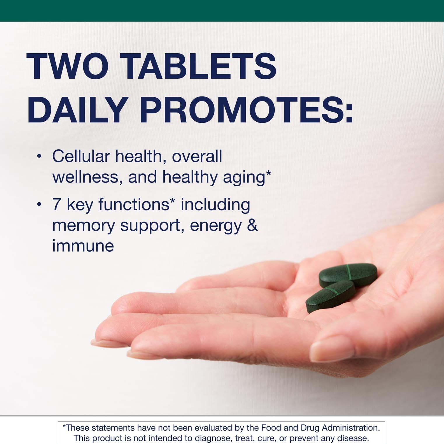 Metagenics PhytoMulti Without Iron capsules beside glass for daily use