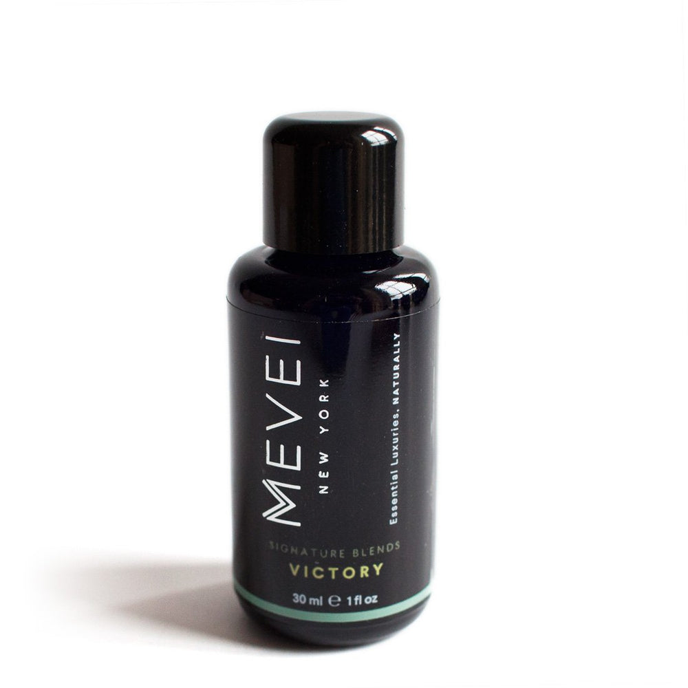 MEVEI Victory bottle pour illustrating easy application during sports massage sessions.